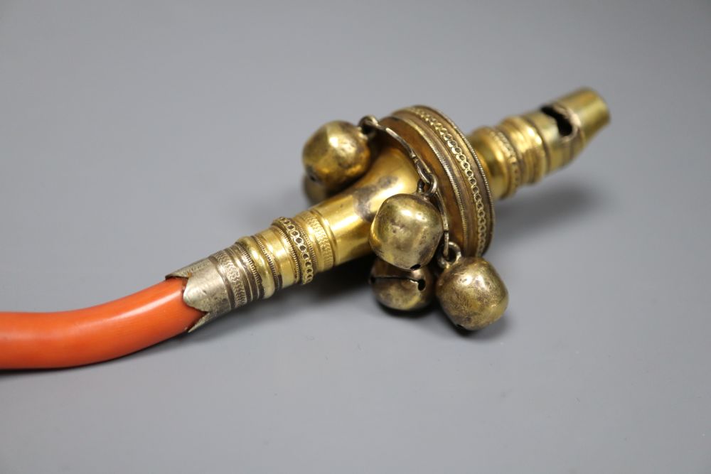 A George III silver gilt and coral set childs rattle, Matthew Chawner, London, 1806, 12.2cm, gross 37 grams.